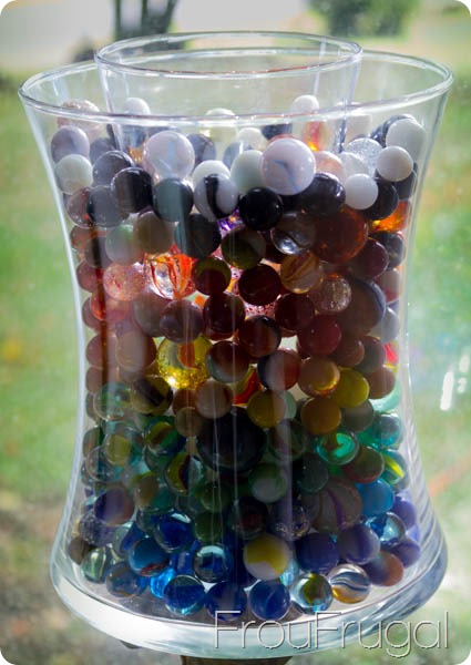 Vintage Glass Marbles in a Vase with a Candle